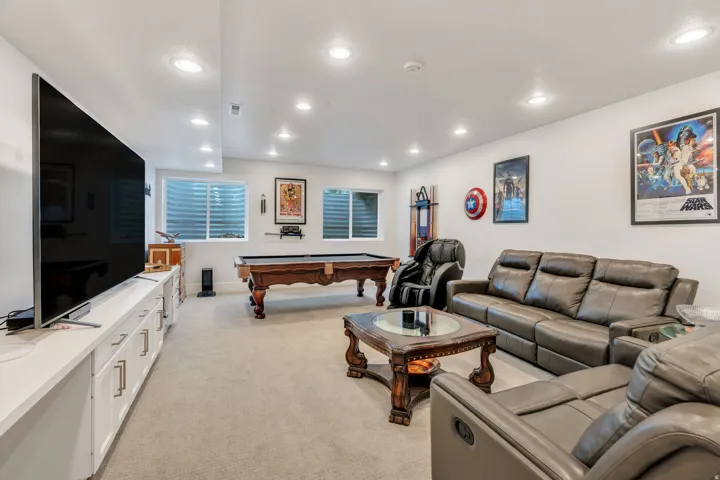 Rec room featuring light carpet, recessed lighting, and pool table