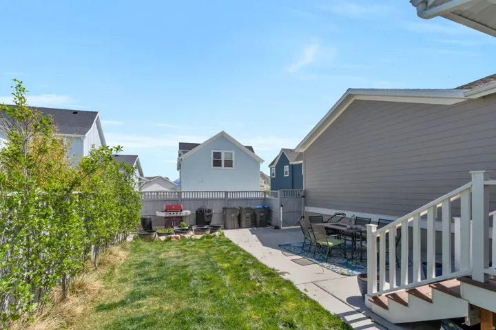 Fenced backyard with a patio and outdoor dining area