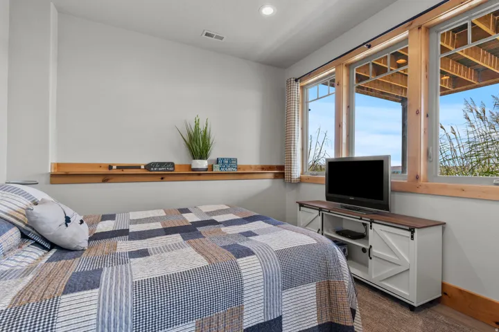 Lowest level # 4 of 4  bedrooms with daylight windows and direct access to family room, full bathroom and laundry facilities. Beautiful barndoors pull open or close off for privacy.
