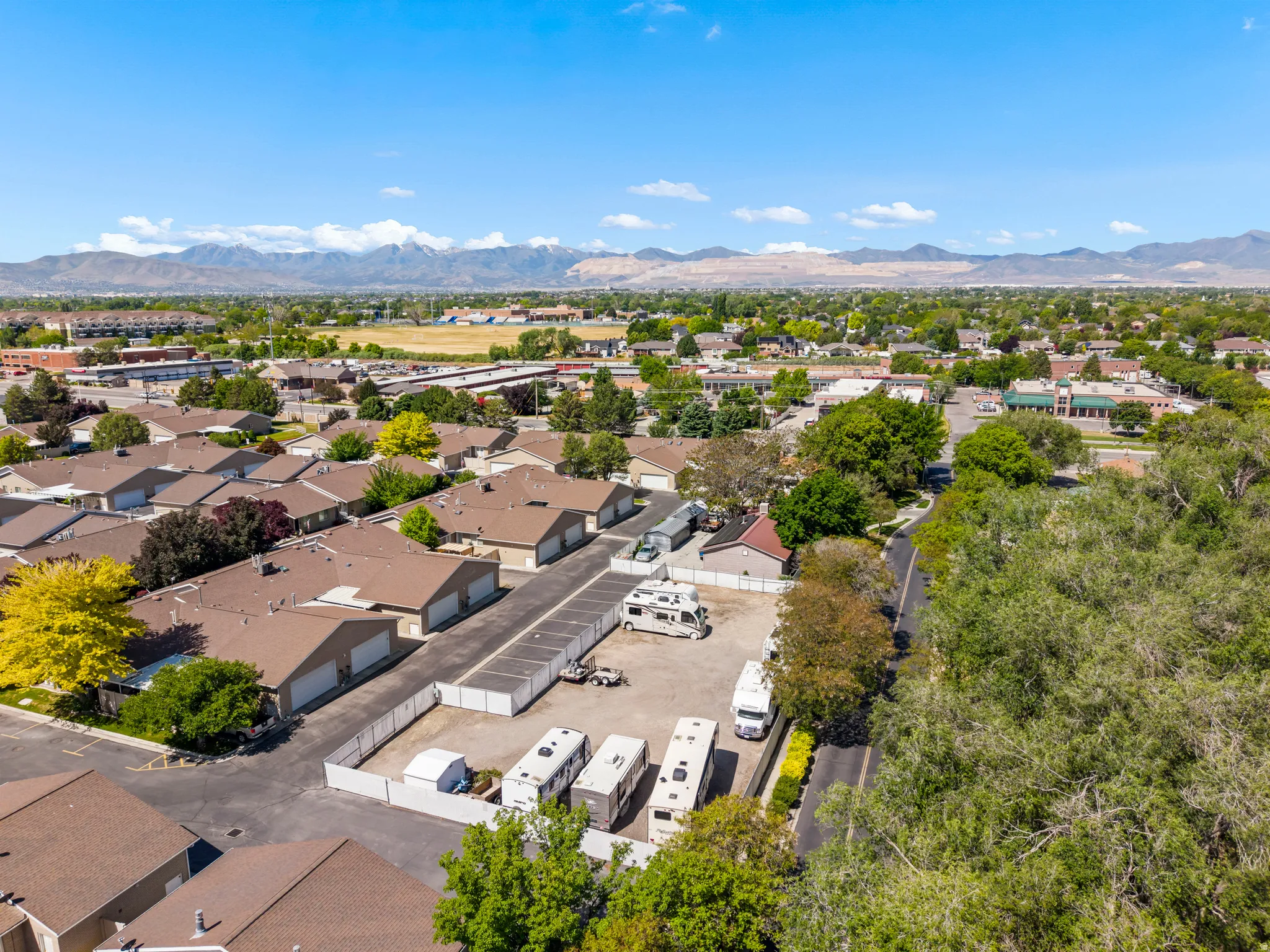 Self-storage facility featuring multiple storage units and ample paved parking