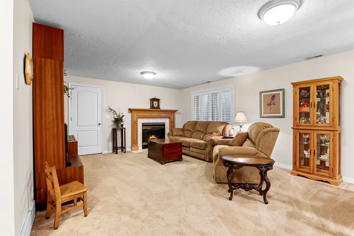 Spacious room featuring carpeting and neutral wall tones