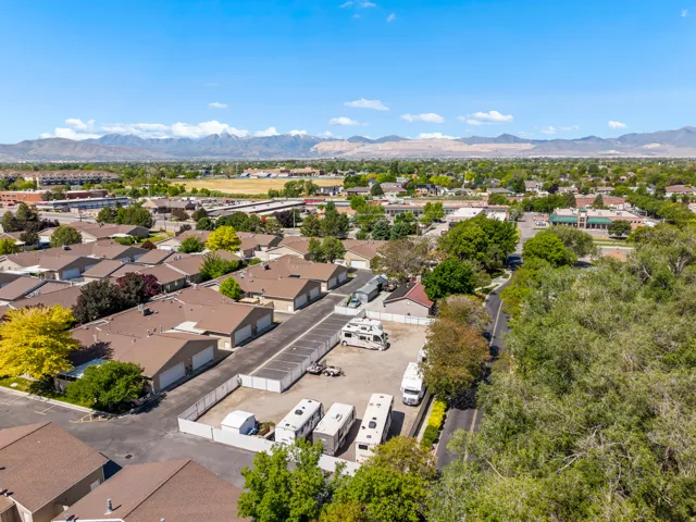 Self-storage facility featuring multiple storage units and ample paved parking