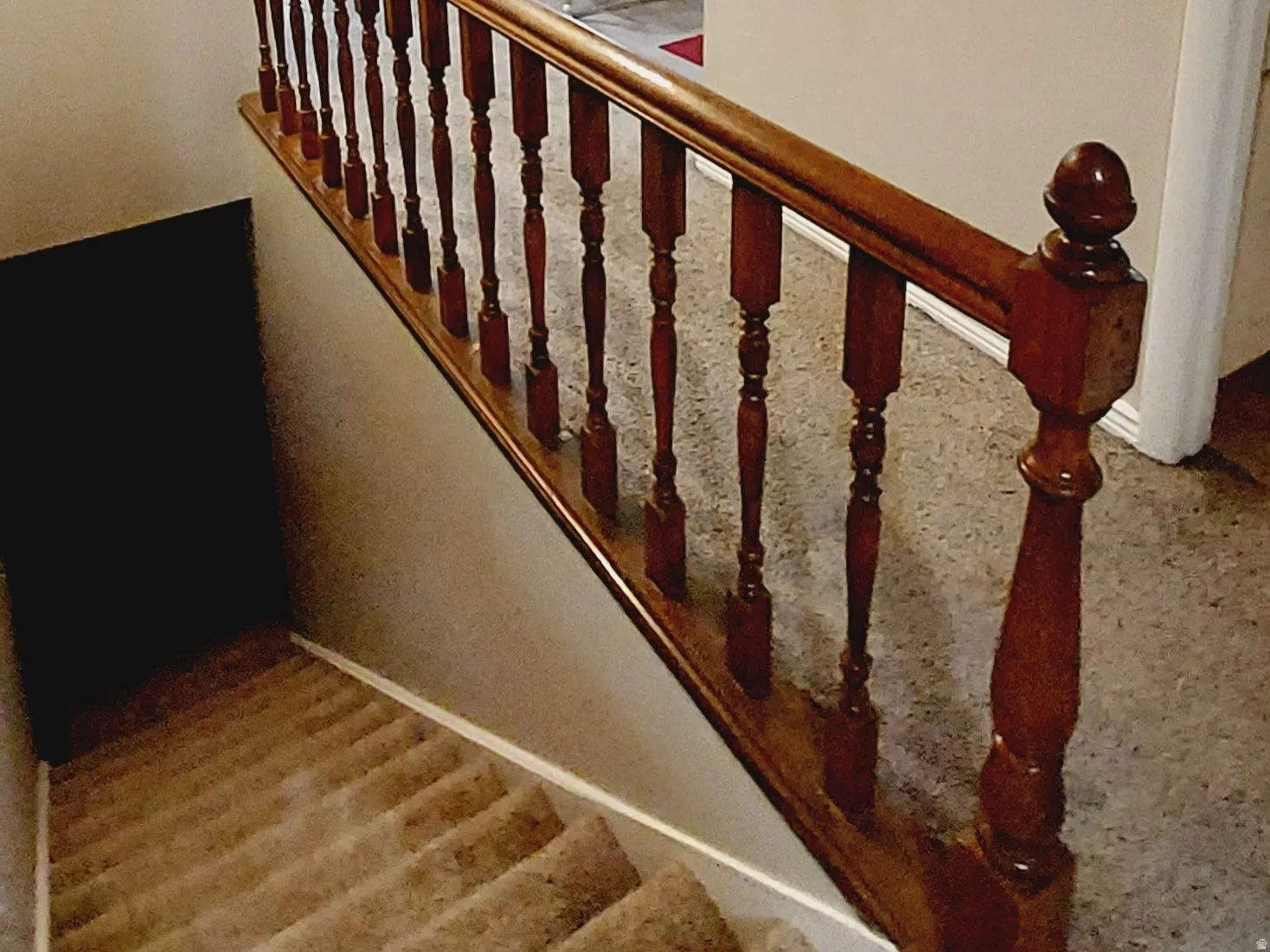 Staircase featuring crown molding.