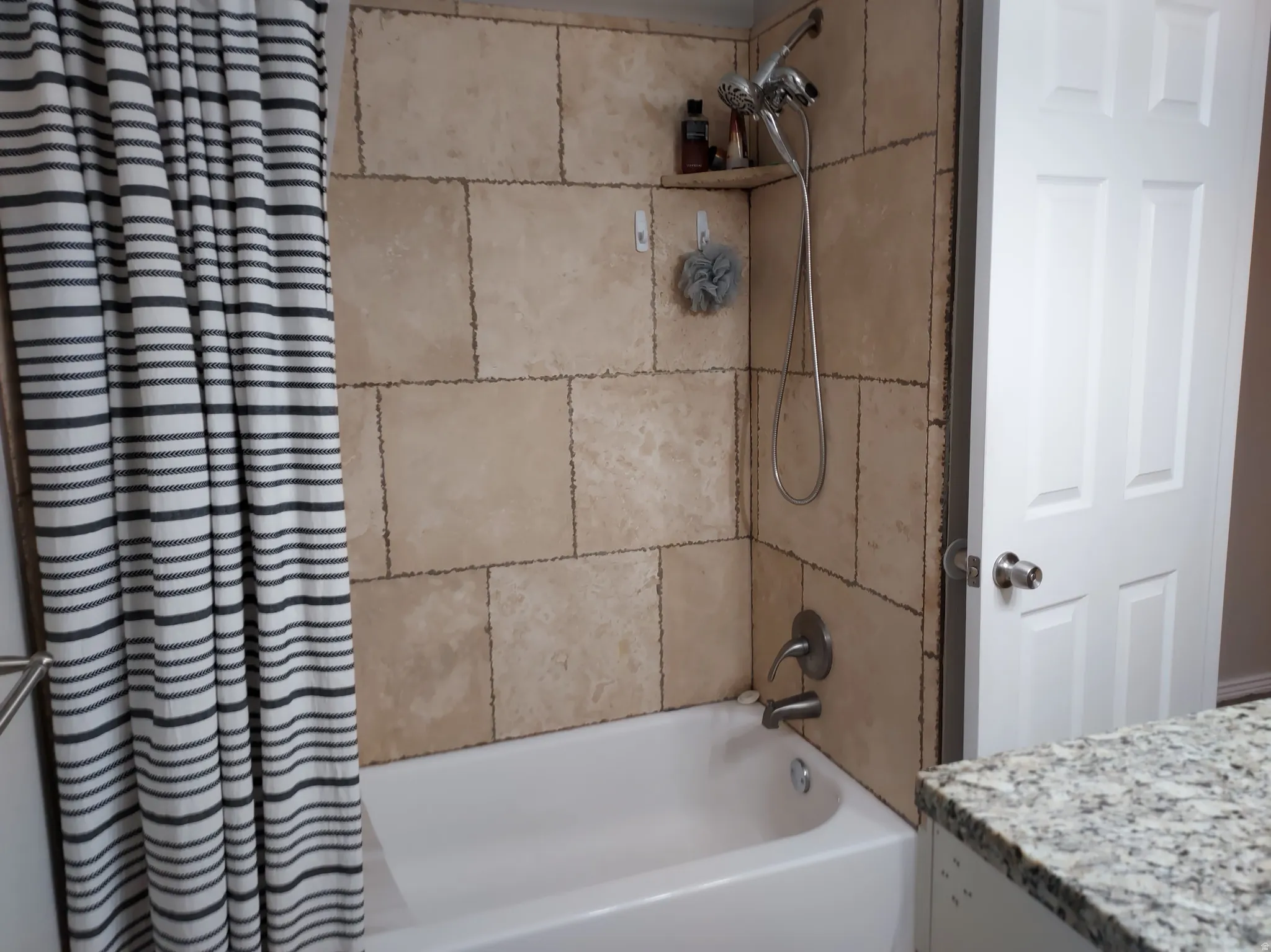 Bathroom with vanity and shower / bath combo