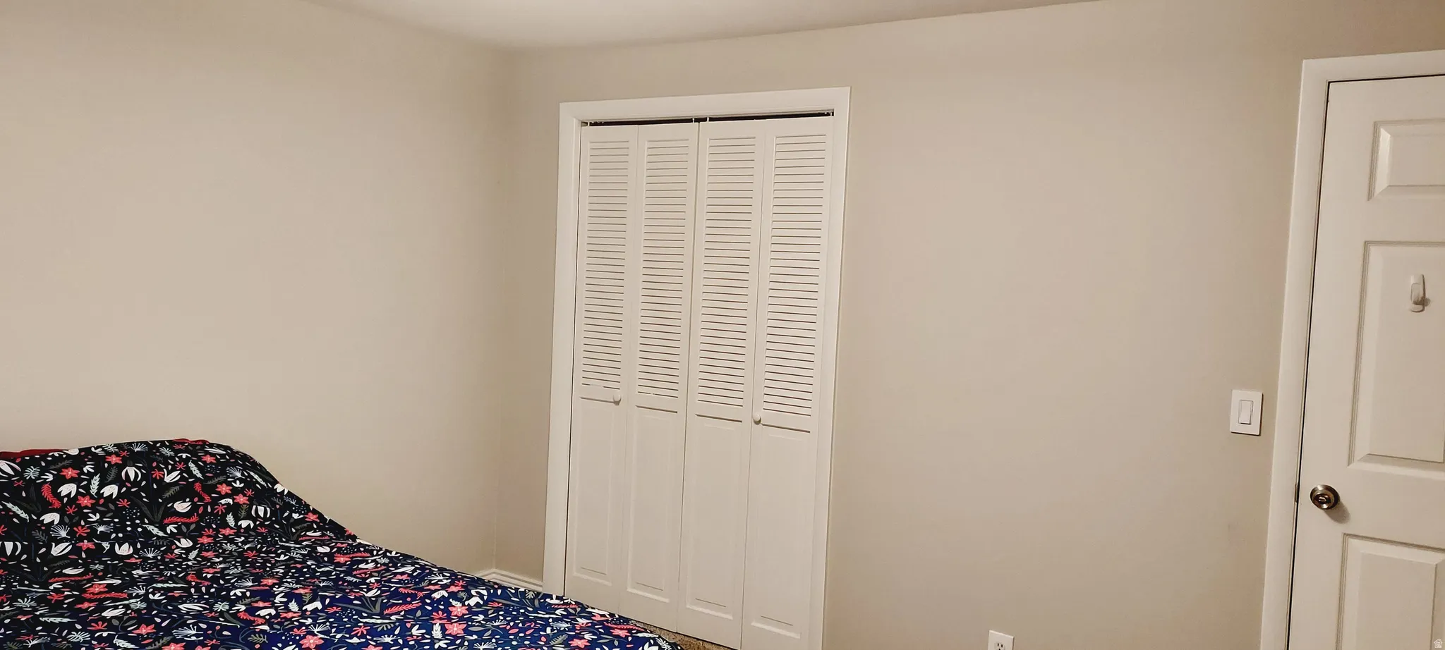 Bedroom with a closet and carpet floors