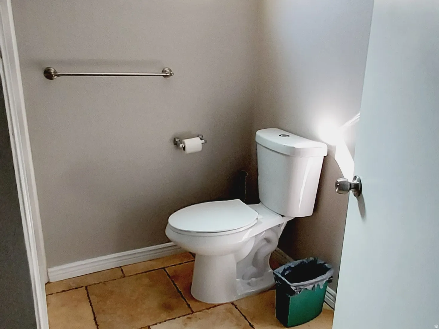 Bathroom with toilet and baseboards