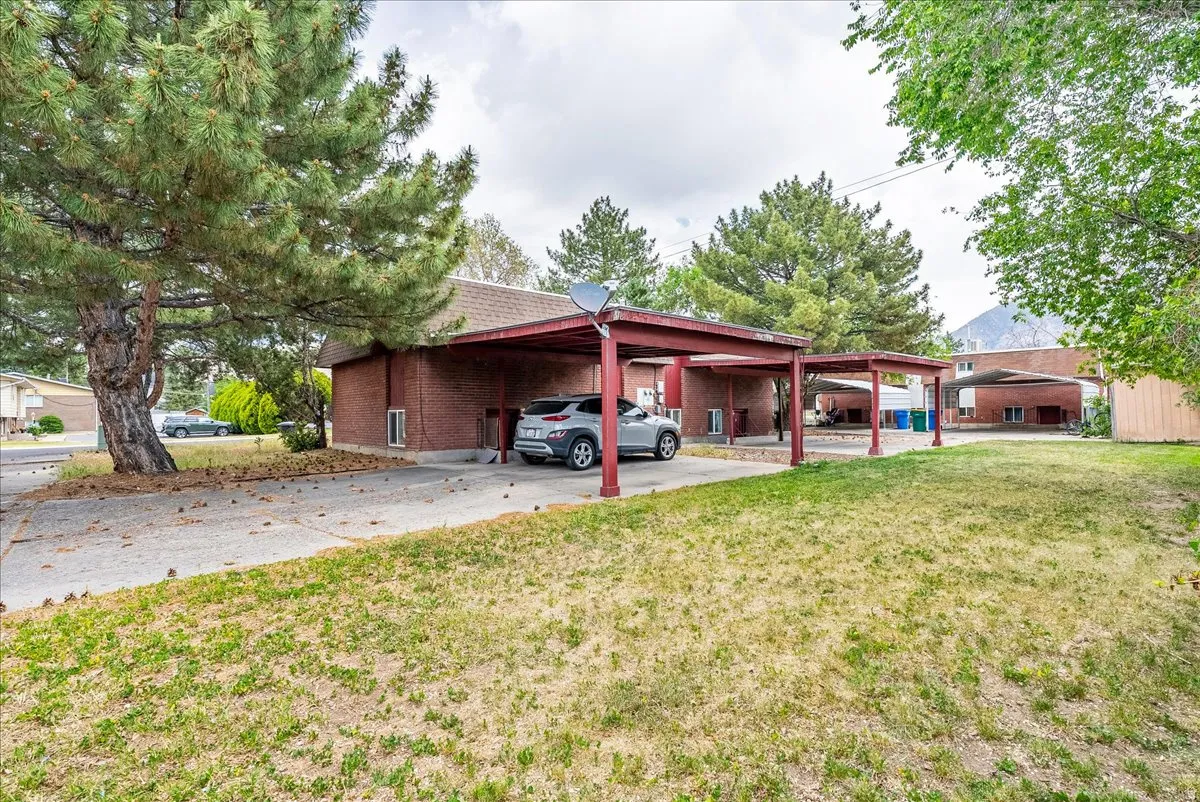 Brick exterior with multiple covered carport spaces