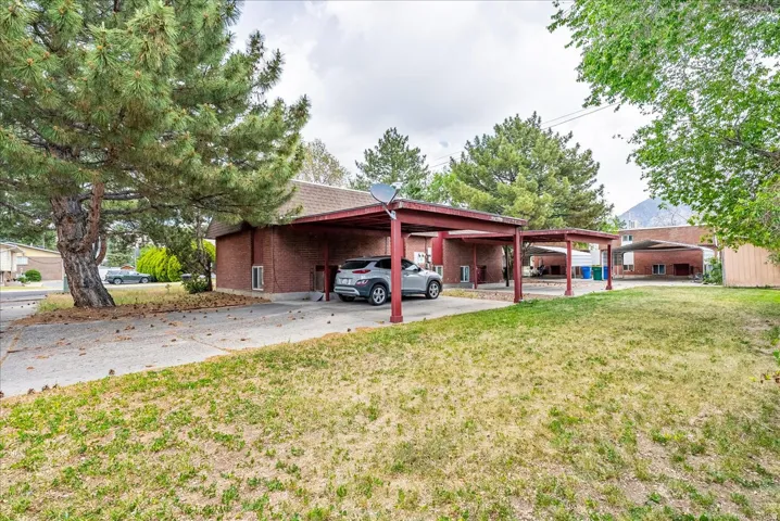 Brick exterior with multiple covered carport spaces