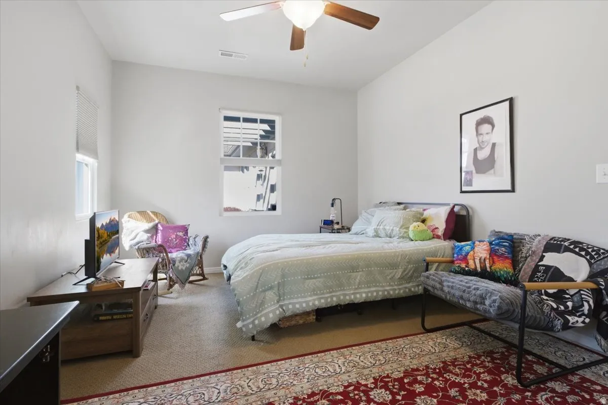 Bedroom featuring vaulted ceilings and neutral wall tones