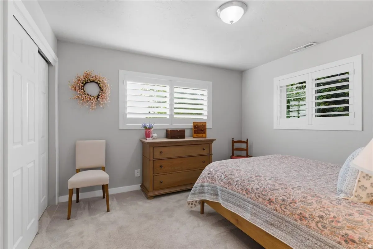 Light gray painted walls complementing light-toned carpeting and white trim