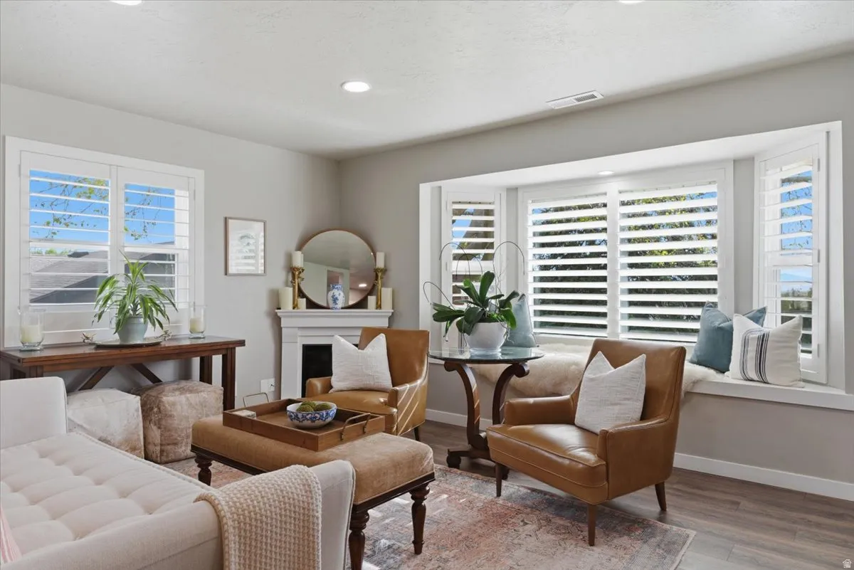 Living area featuring wood-finish flooring and a neutral color palette