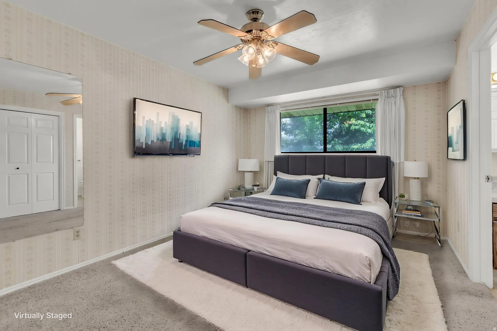 Virtually Staged -Carpeted room with a ceiling fan light fixture