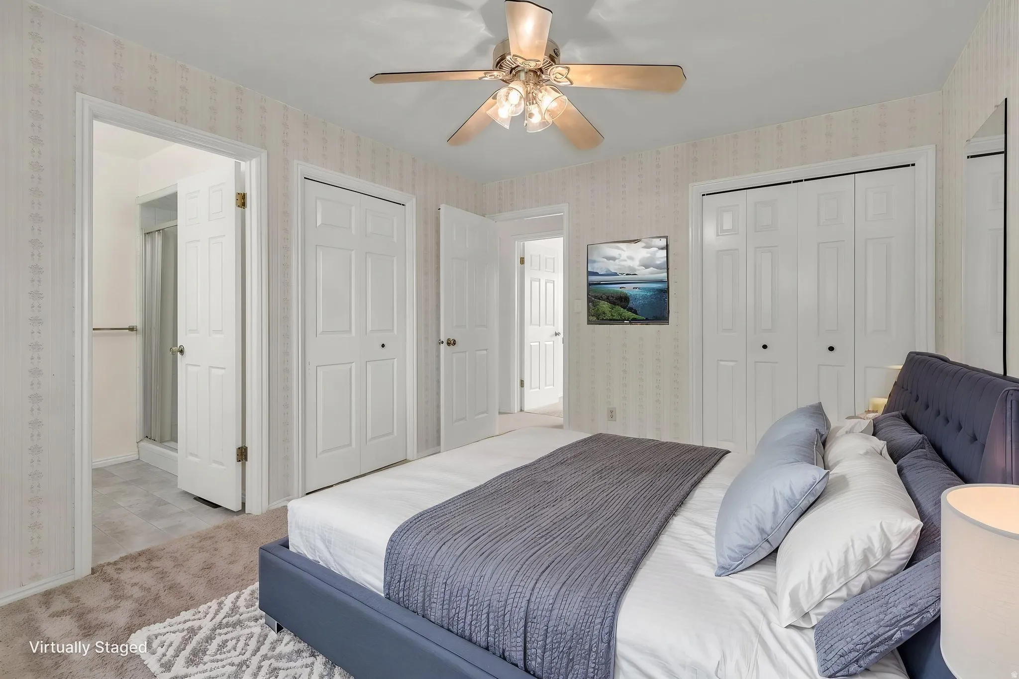 Virtually Staged -Recessed lighting with a ceiling fan, patterned wallpaper, a closet with bi-fold doors, and a tile-floor bathroom with a shower