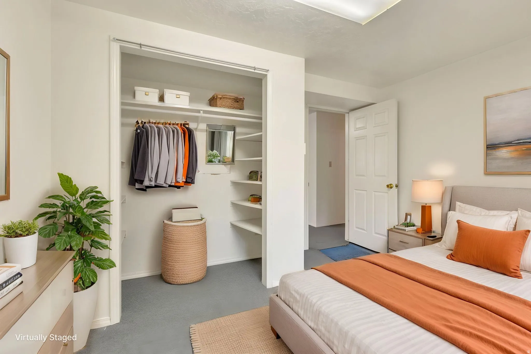 Virtually Staged -Bedroom featuring neutral-toned carpeting and a closet with built-in shelving