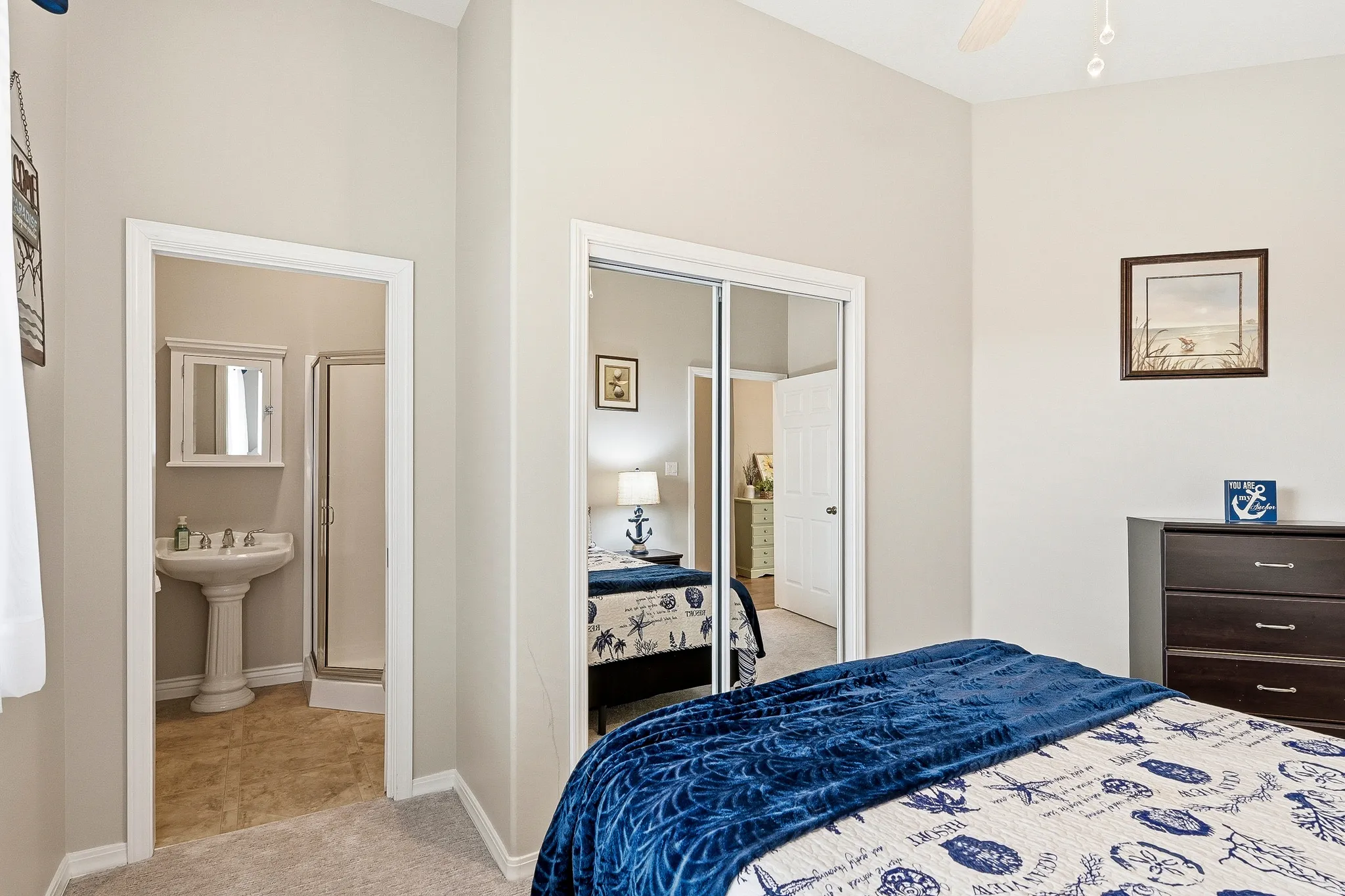 Bedroom featuring light gray wall paint and carpeted flooring