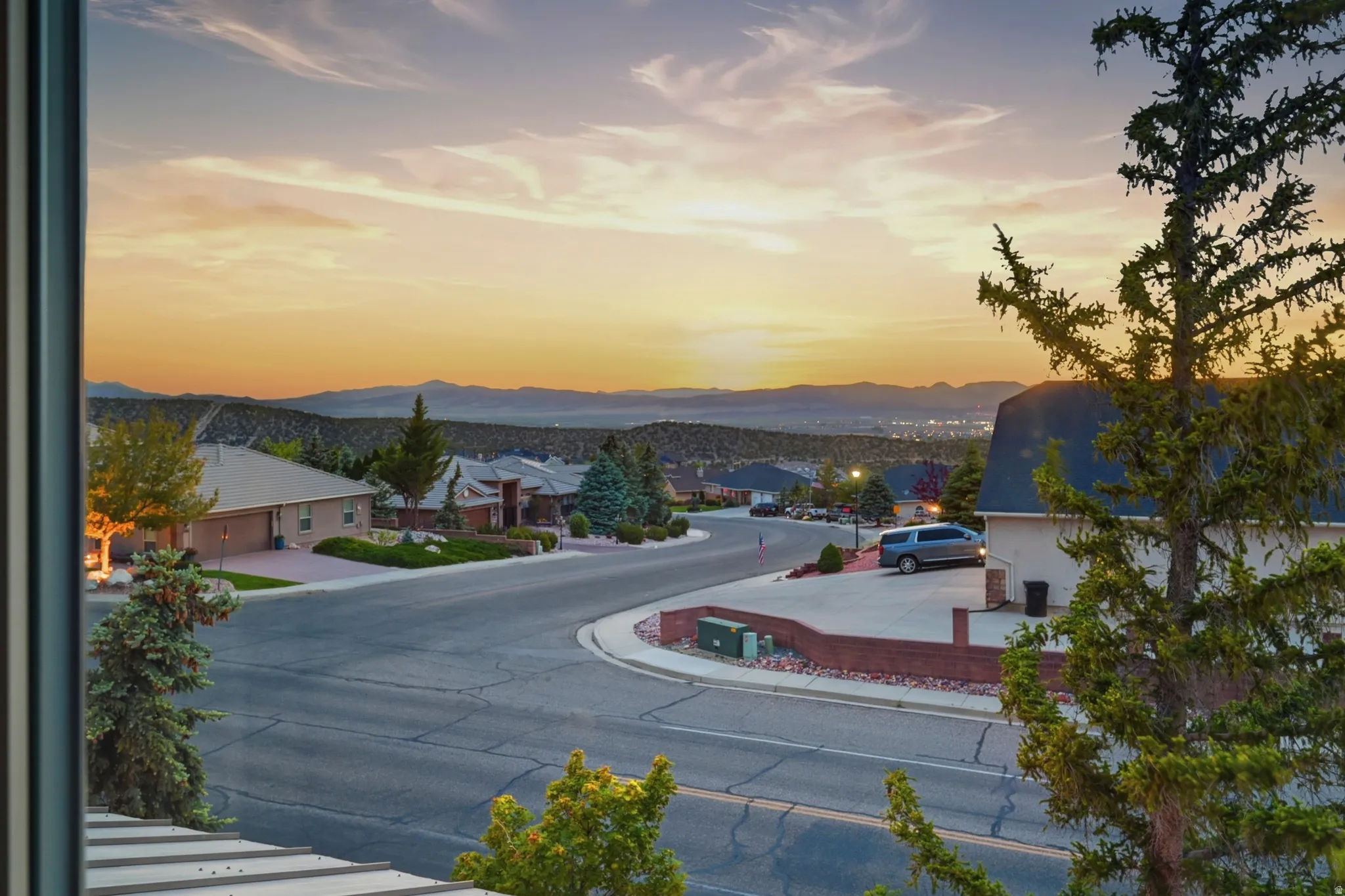 Expansive neighborhood vista with distant mountain ranges