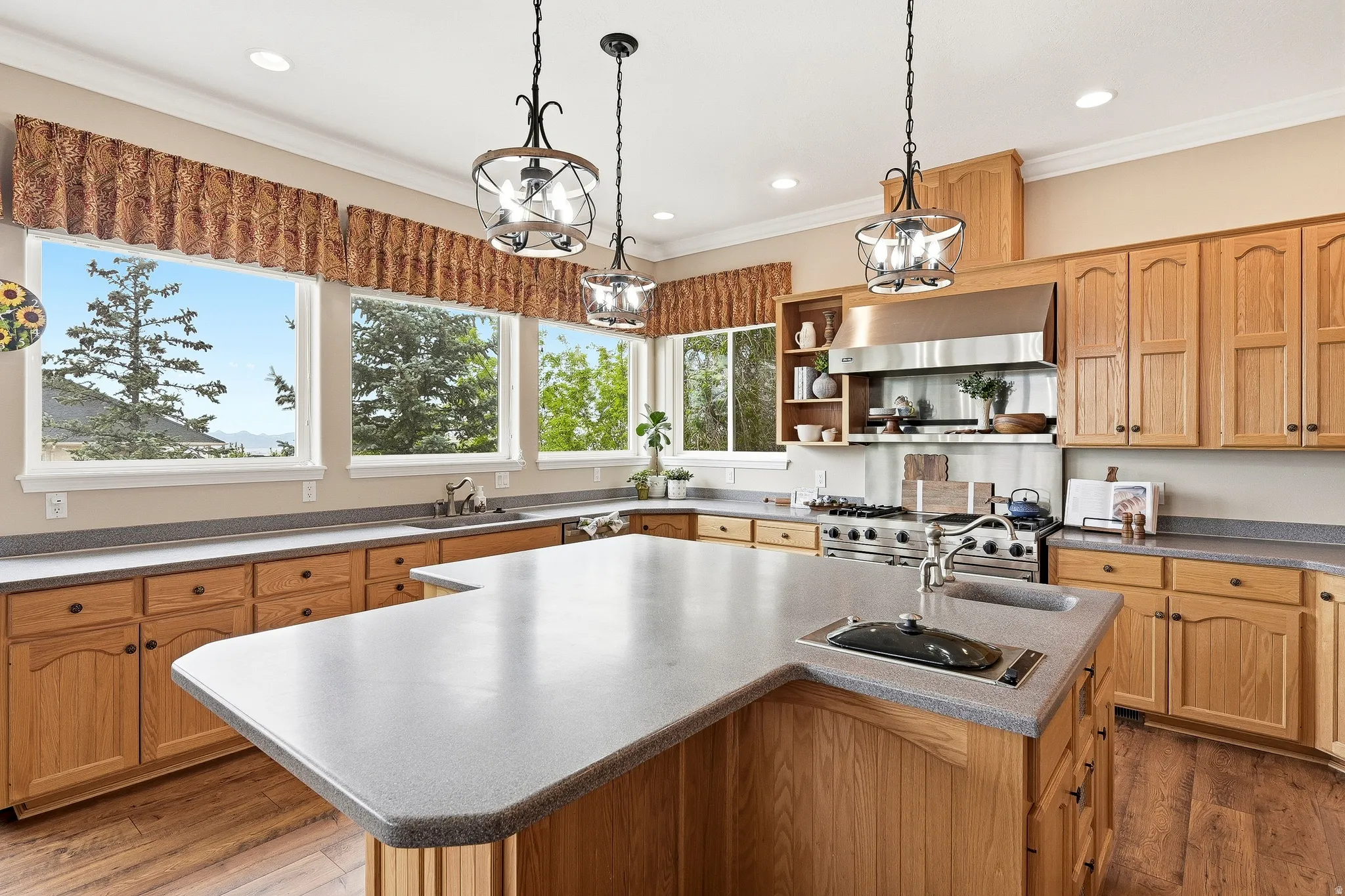 U-shaped kitchen island with an integrated sink and light gray countertop