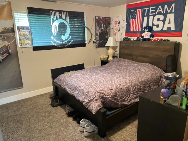 Bedroom featuring neutral wall paint and plush carpet flooring