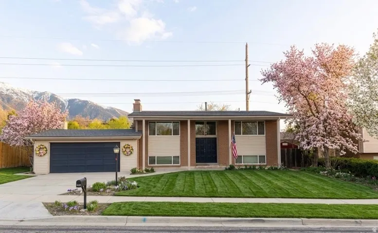 Split-level residence featuring a two-car garage