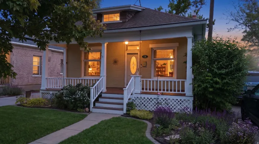 Inviting front porch with white railings and lattice detailing