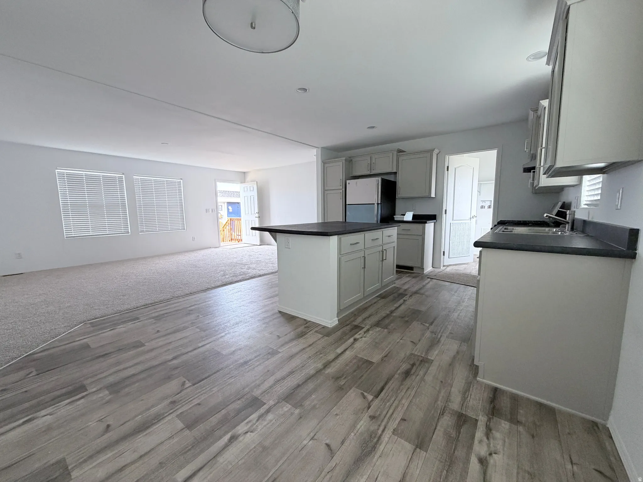 View of the kitchen looking into the living area