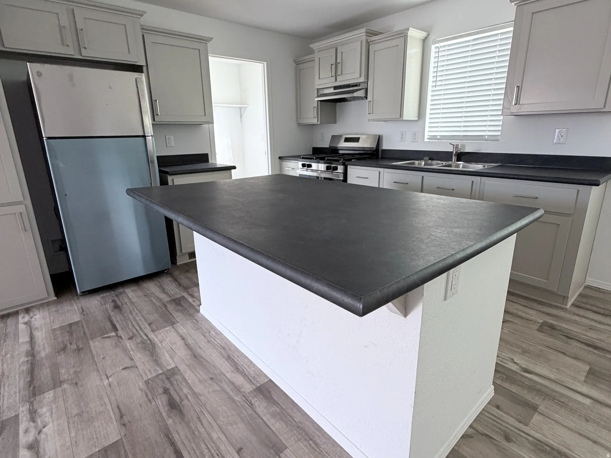 Kitchen Island featuring dark countertop