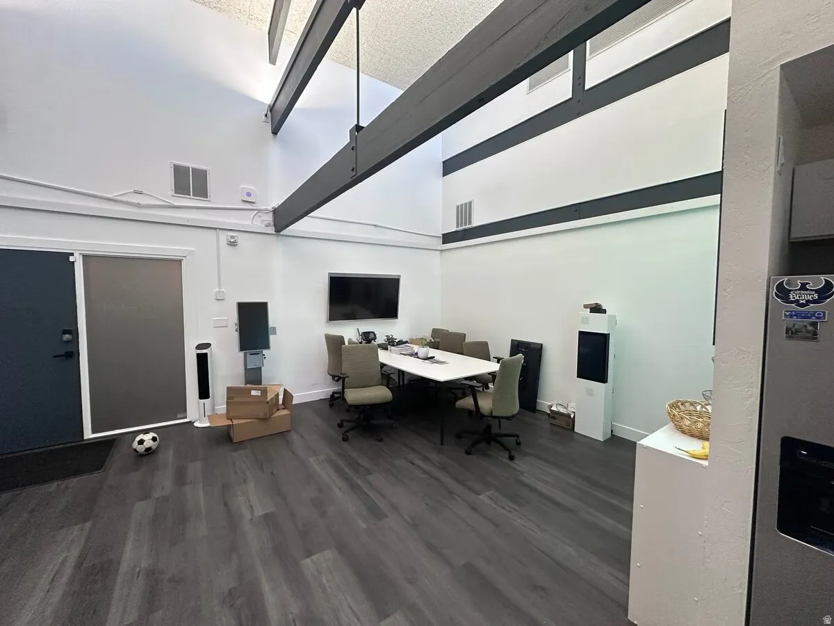 Spacious interior with high vaulted ceilings and exposed industrial-style beams