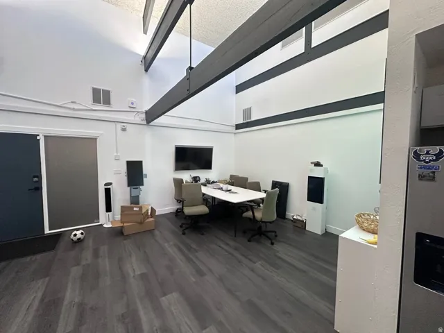 Spacious interior with high vaulted ceilings and exposed industrial-style beams