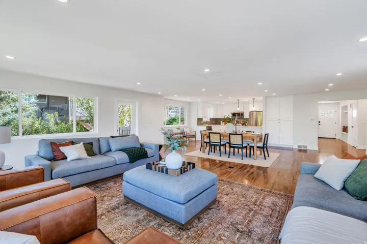 Open concept living space featuring wood-finish flooring throughout