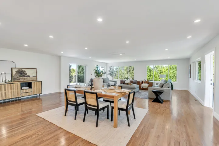 Spacious interior featuring wood-finish flooring throughout, recessed lighting, and expansive windows