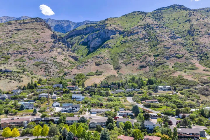Mountainous landscape with residential properties nestled into the foothills