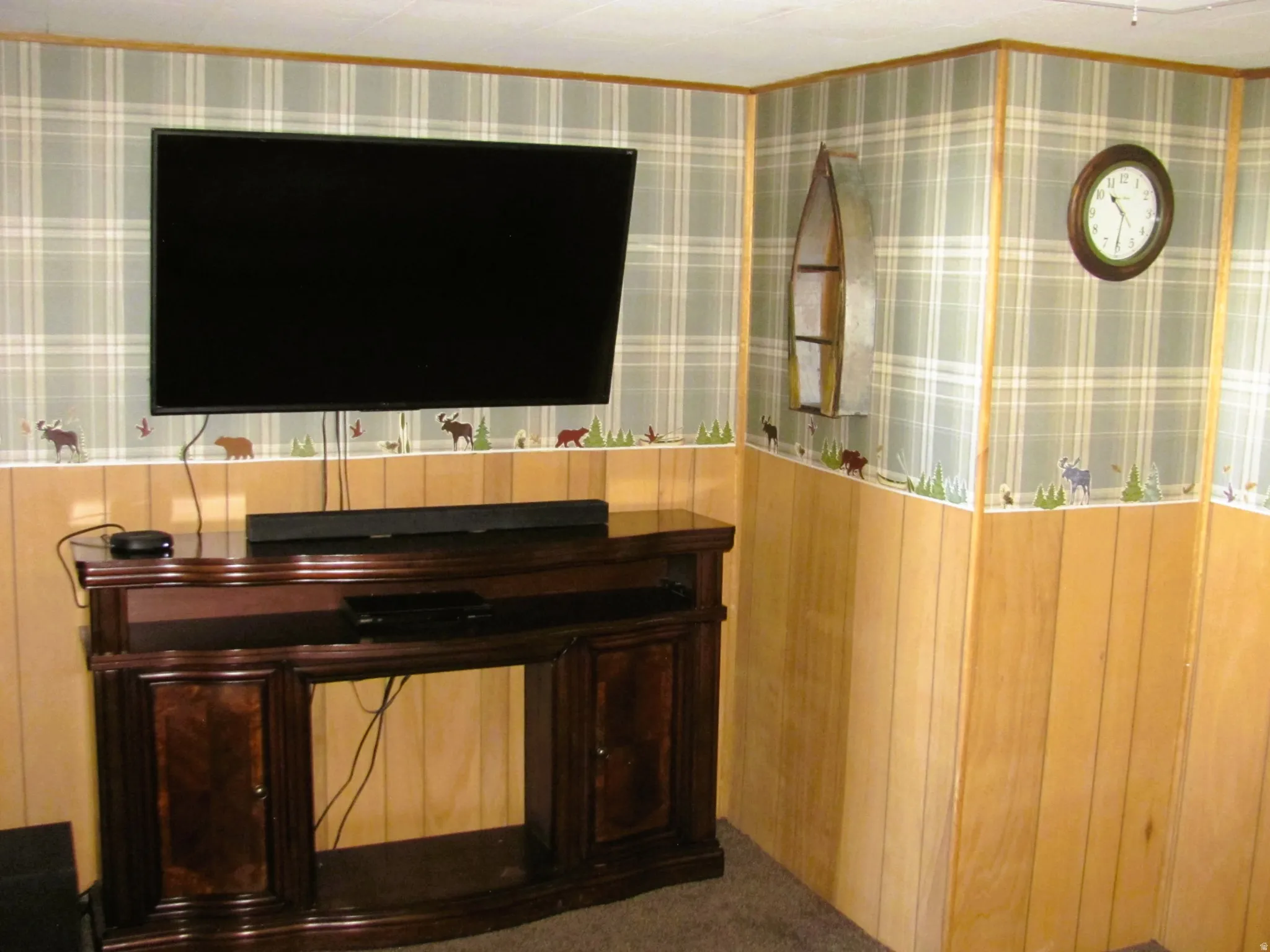 Paneled walls with plaid wallpaper