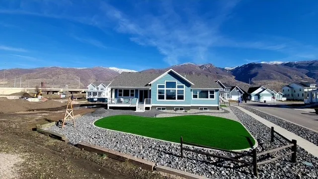 Light blue siding exterior featuring multiple window styles