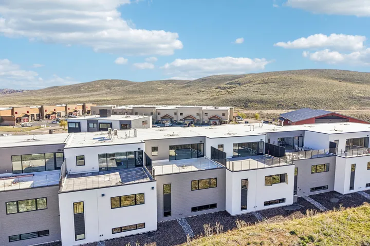 Modern residential architecture featuring a flat roofline and multi-toned facade