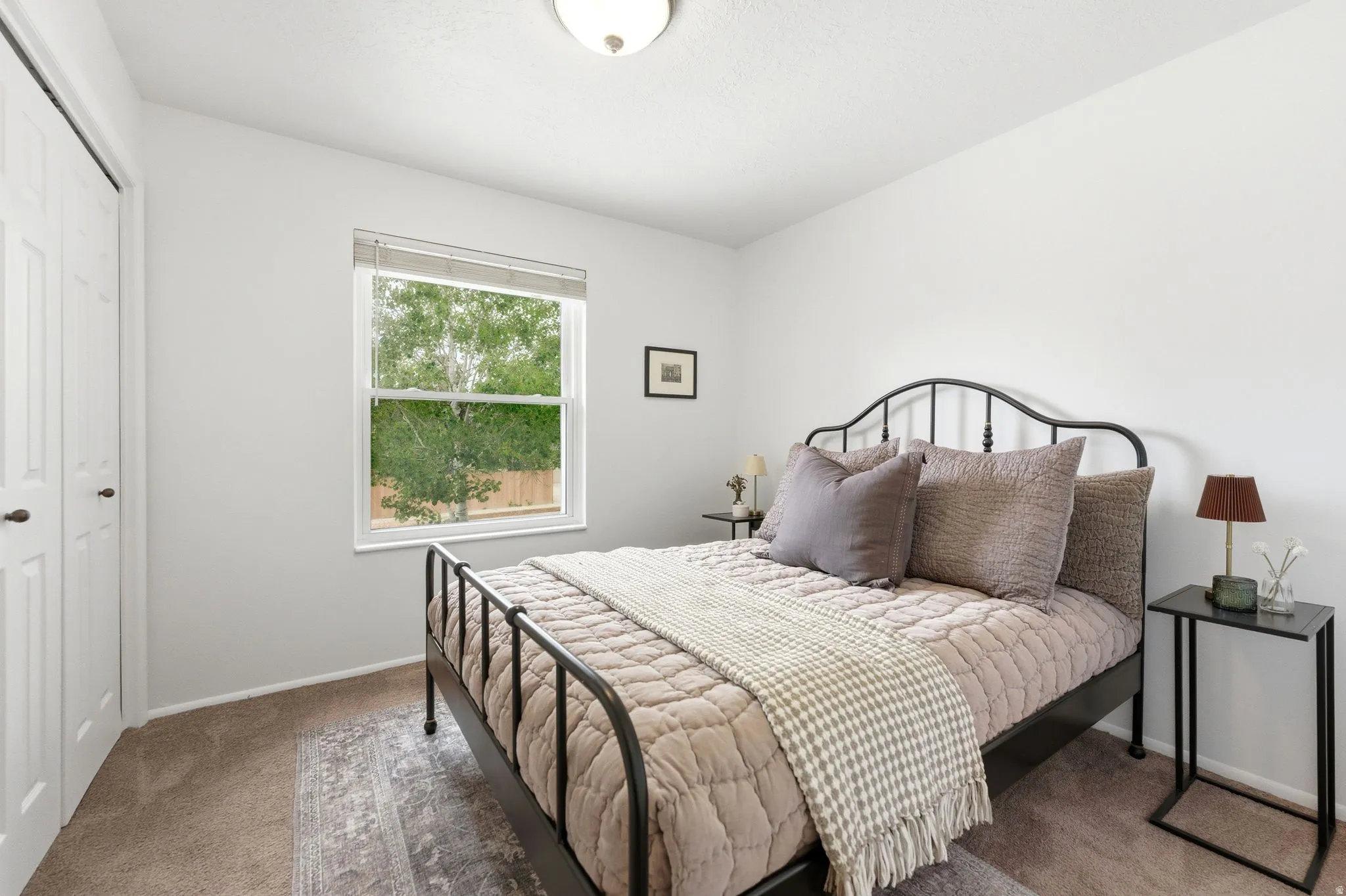 Neutral paint palette, carpet flooring, and a window with blinds