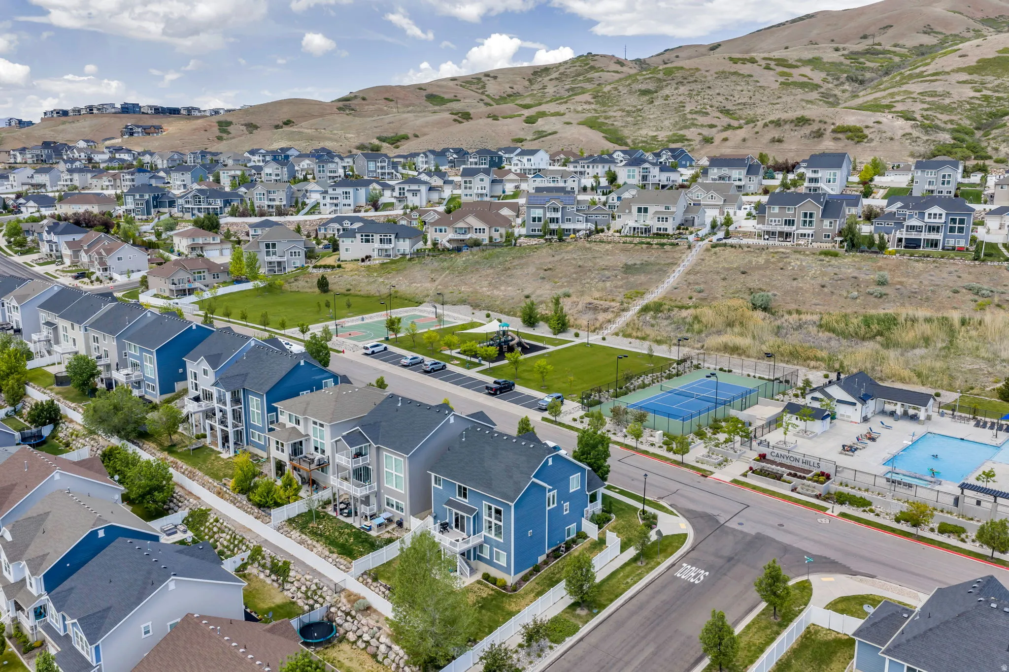 Aerial depiction of a residential community featuring varied architectural styles