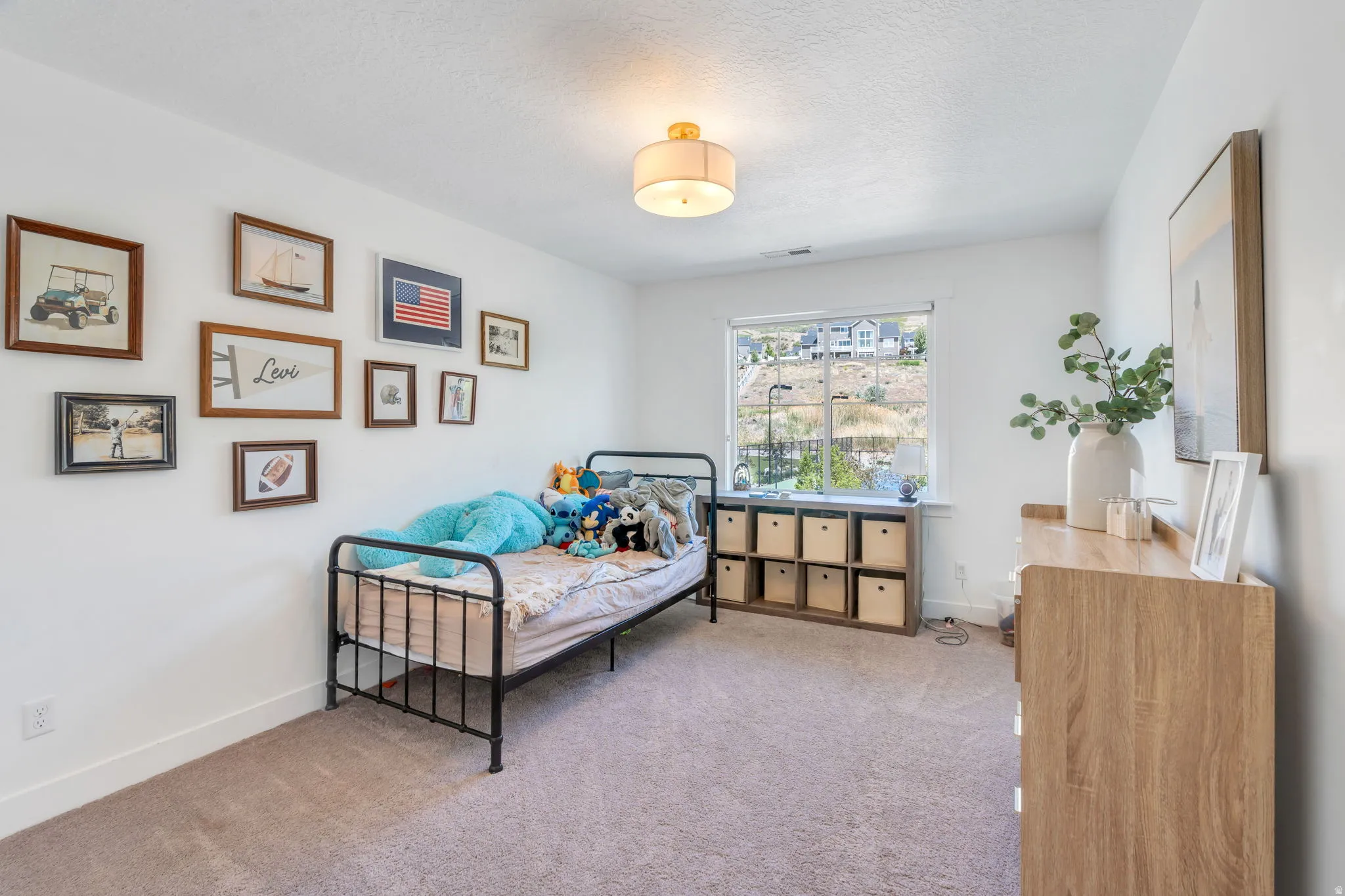 Carpeted room featuring a double-paned window, neutral wall paint, white baseboards, and a semi-flush mount ceiling light fixture