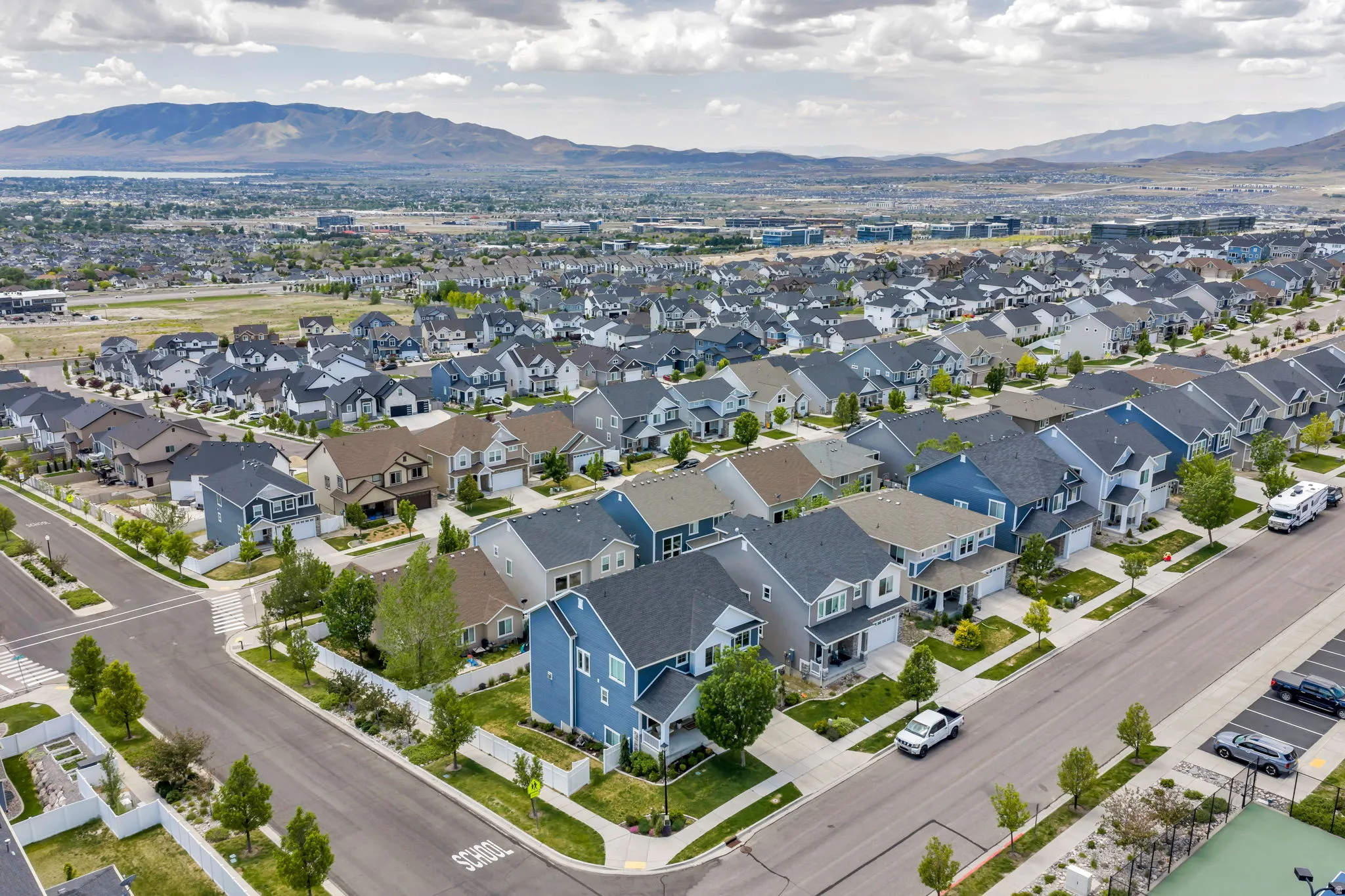 Residential neighborhood featuring single-family homes with varied architectural styles and front yard landscaping