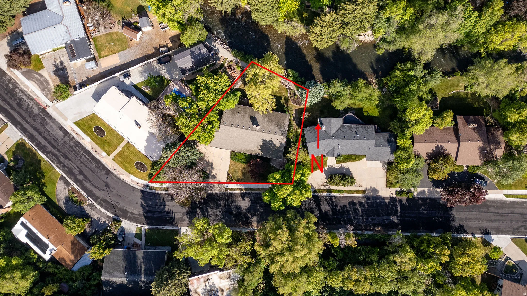 Aerial view showcasing property boundaries outlined in red