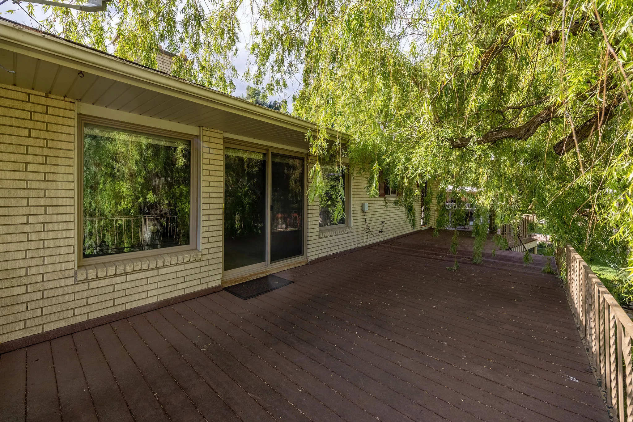 Expansive wood deck with a metal railing