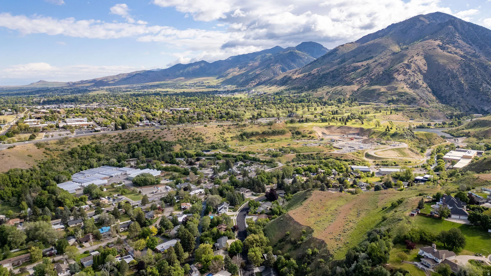 Expansive mountainous backdrop framing a verdant landscape