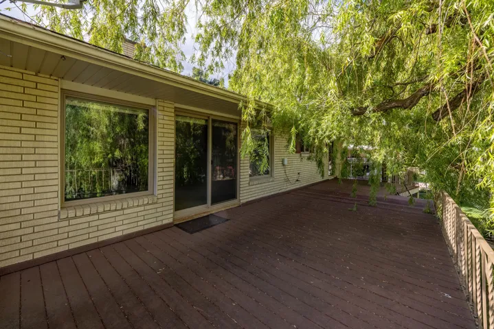 Expansive wood deck with a metal railing