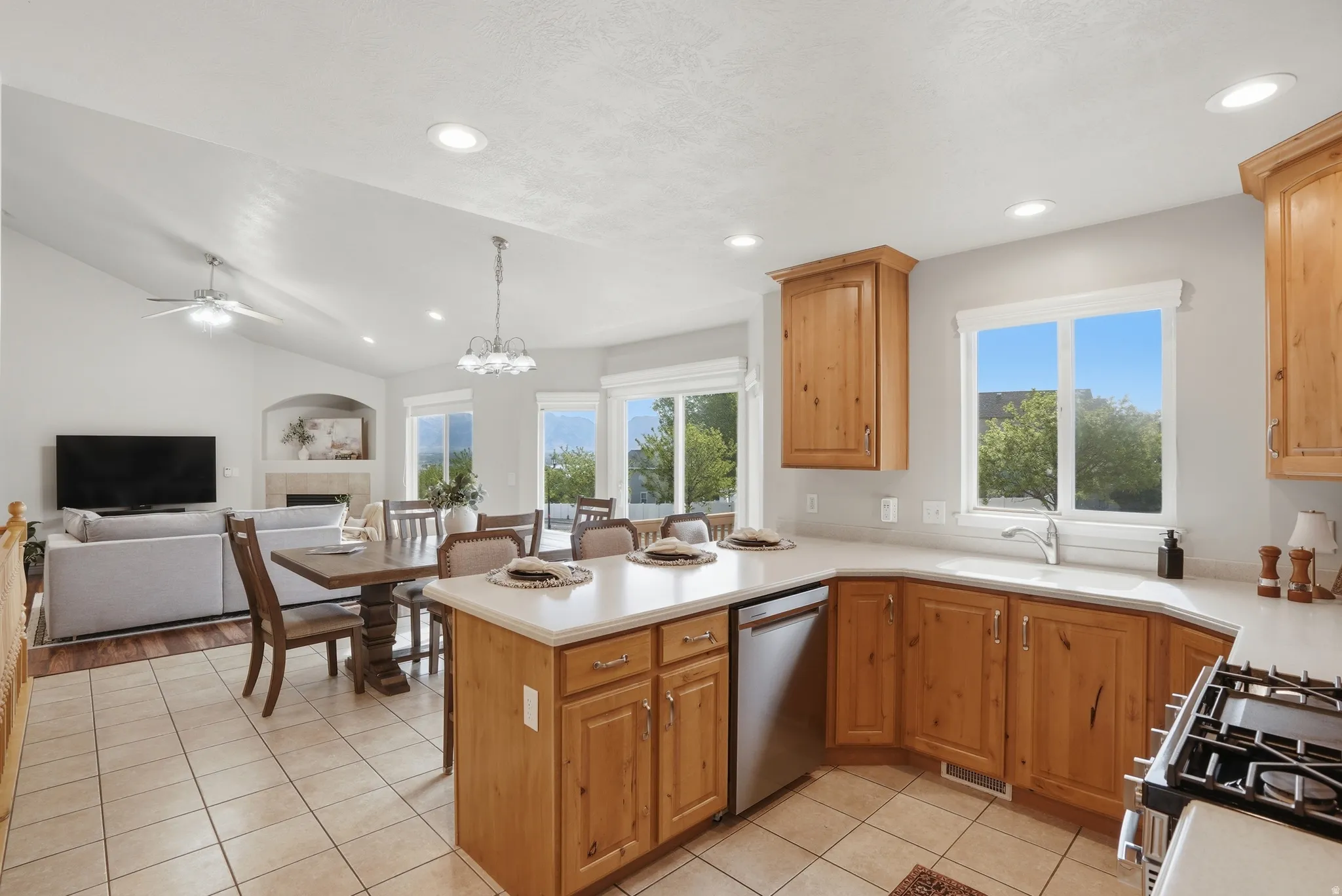 Kitchen featuring wood cabinetry, light-toned countertops, and tile flooring