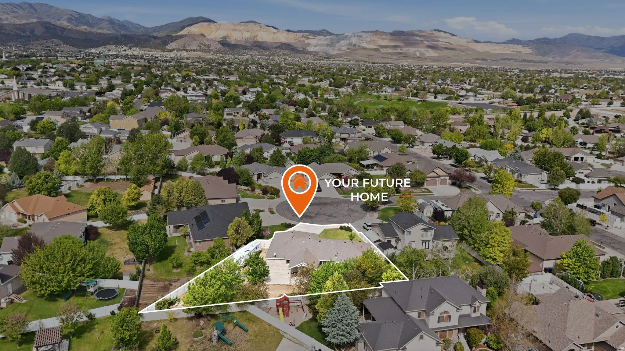 Aerial perspective showcasing a residential property within a suburban setting, featuring mature trees and established landscaping