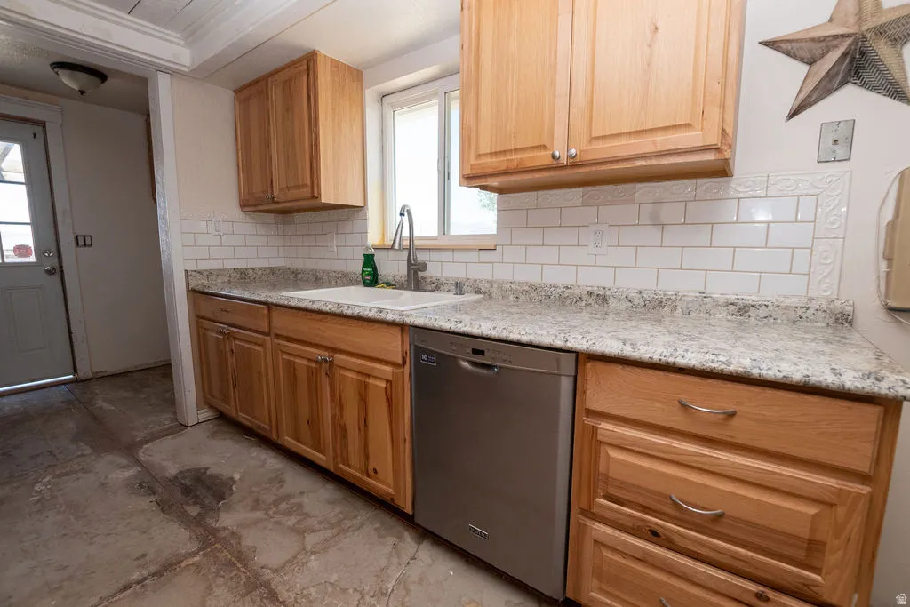 Light wood-finish cabinetry featuring a light-toned countertop