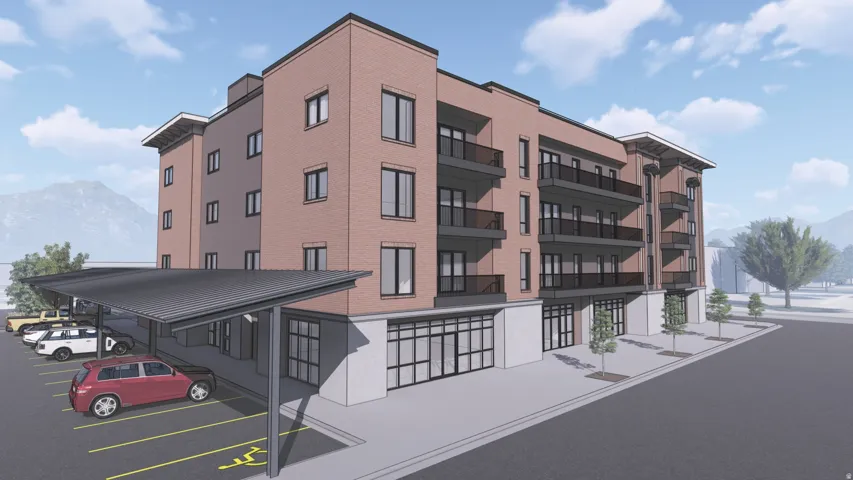 Contemporary multi-story building featuring a brick facade and ground-level commercial spaces