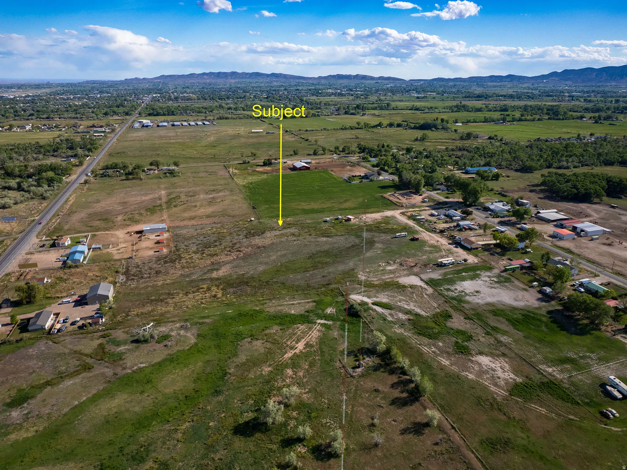 Expansive rural property featuring an undeveloped land parcel