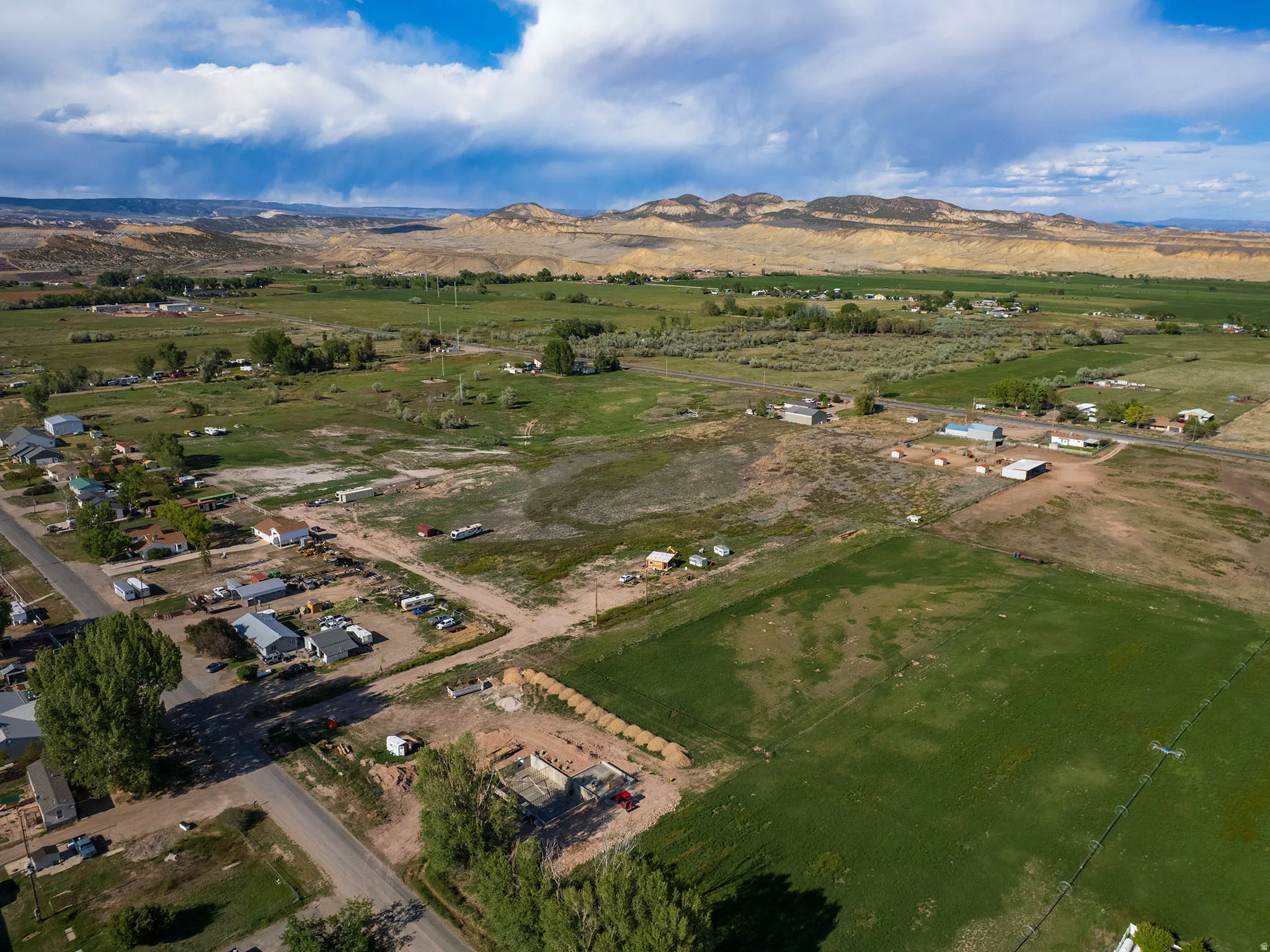 Expansive rural landscape featuring a mix of developed lots, agricultural fields, and undeveloped land