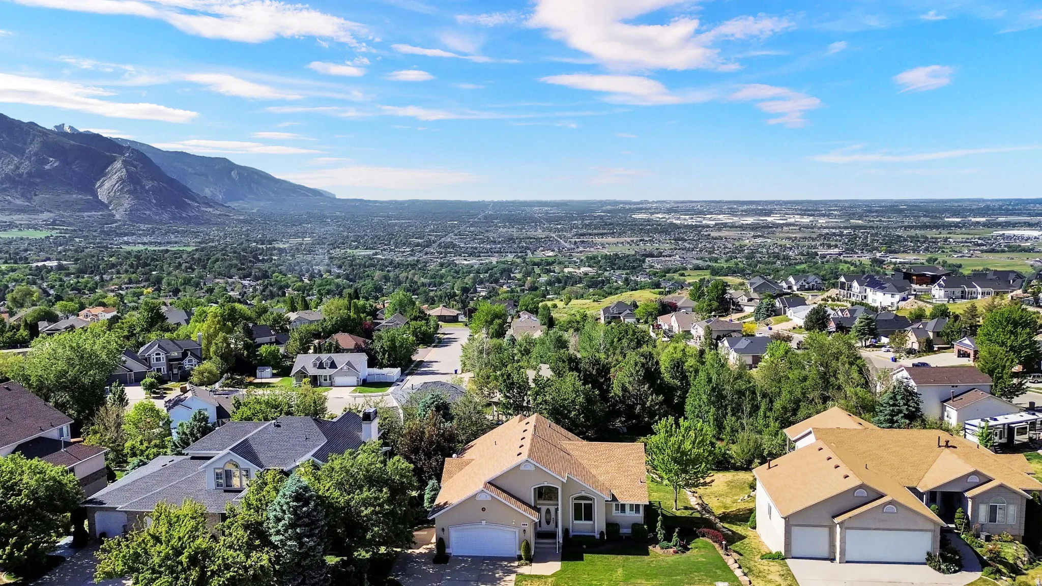 Residential neighborhood featuring a variety of single-family homes with pitched roofs and attached garages