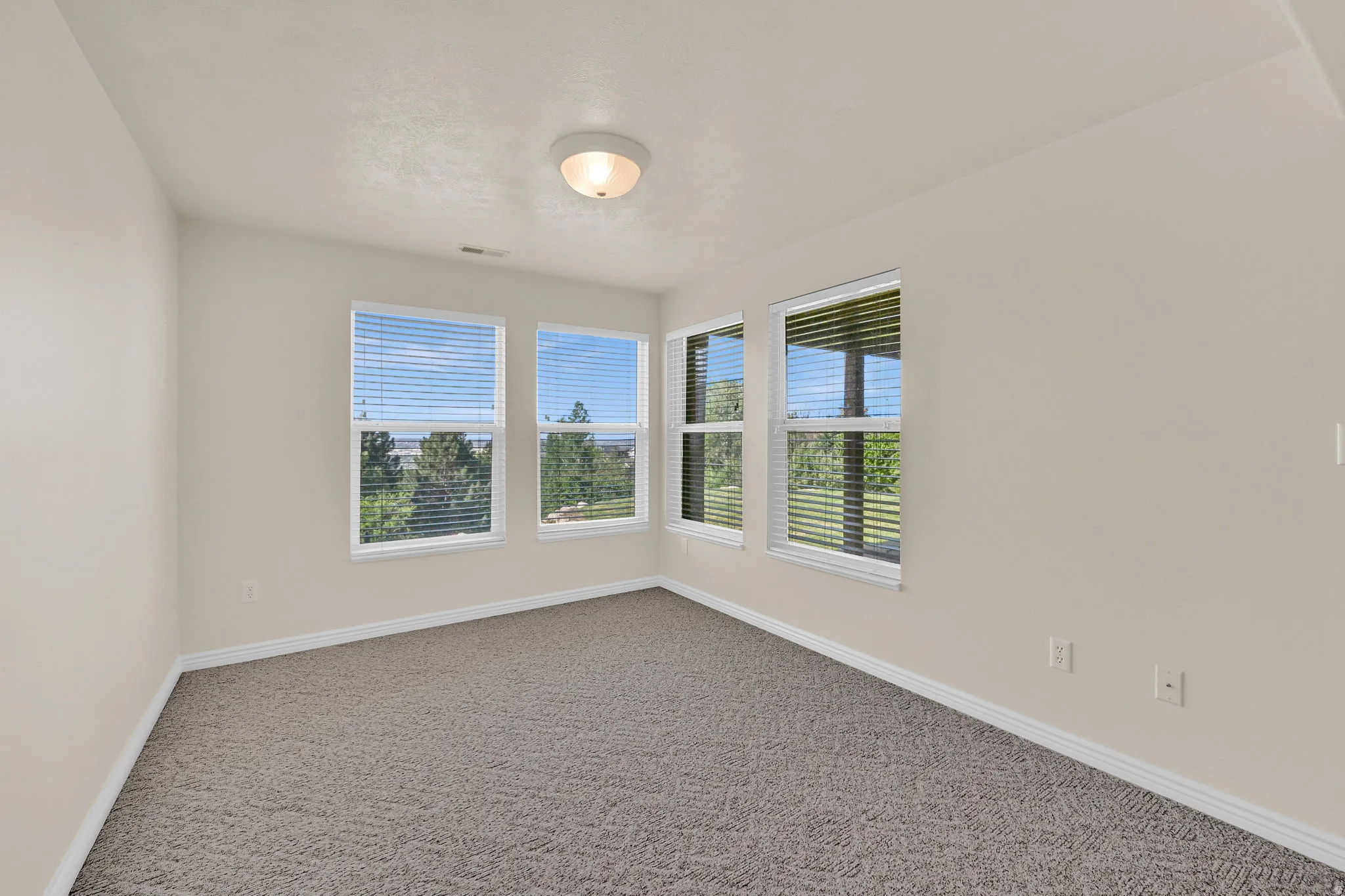 Neutral wall paint complemented by white trim